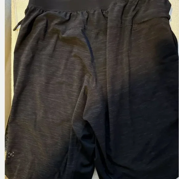 FOUR PAIRS OF VINTAGE LIMITED EDITION LULULEMON PACEBREAKER 9" ATHLETIC SHORTS